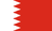 The flag of Bahrain has a red field. On the hoist side, it features a white vertical band that spans about one-third the width of the field and is separated from the rest of the field by five adjoining fly-side pointing white isosceles triangles that serve as a serrated line.