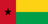 The flag of Guinea-Bissau features a red vertical band on its hoist side that takes up about two-fifth the width of the field, and two equal horizontal bands of yellow and green adjoining the vertical band. A five-pointed black star is centered in the vertical band.