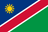 The flag of Namibia features a white-edged red diagonal band that extends from the lower hoist-side corner to the upper fly-side corner of the field. Above and beneath this band are a blue and green triangle respectively. A gold sun with twelve triangular rays is situated on the hoist side of the upper triangle.