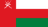 The flag of Oman features a red vertical band on the hoist side that takes up about one-fourth the width of the field, and three equal horizontal bands of white, red and green adjoining the vertical band. At the top of the vertical band is the white emblem of Oman.