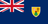 The flag of the Turks and Caicos Islands is blue with the UK flag in the canton and the colonial shield centered on the fly half. The shield is yellow and displays a conch shell, a spiny lobster, and a cactus.