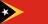 The flag of Timor-Leste has a red field with two isosceles triangles which share a common base on the hoist end. The smaller black triangle, which bears a five-pointed white star at its center and spans one-third the width of the field, is superimposed on the larger yellow triangle that extends to the center of the field.